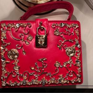 Elegant Red Clutch with Gold Embellishments